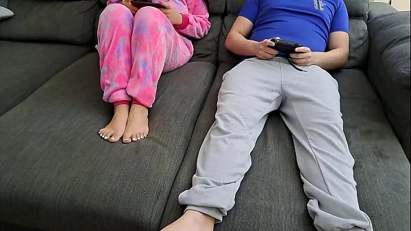 Stepsister sucks stepbrother and eats his sperm while he plays video games