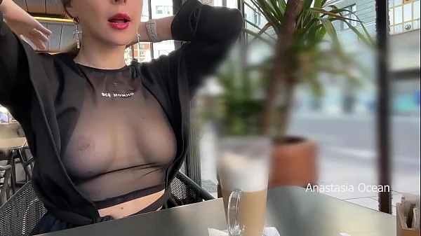 Flashing tits in cafe with glass walls so all people outside see me. Transparent t-shirt no bra.