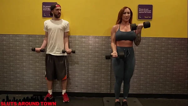 Personal trainer gives private lesson to guy at the gym