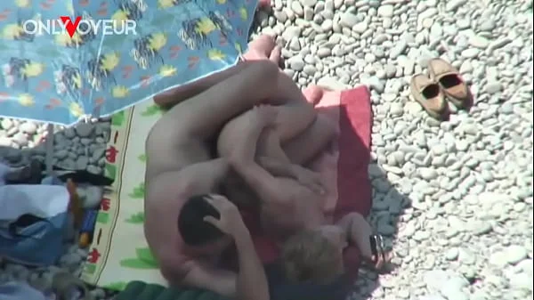 Beach Voyeur. Mature couple fucking under the shining sun