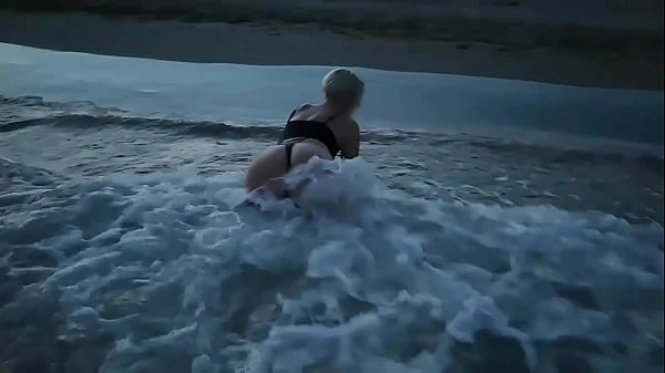 Blonde shows tits and sucks cock on a public beach