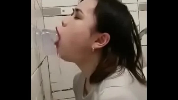 Asian deepthroating a dildo