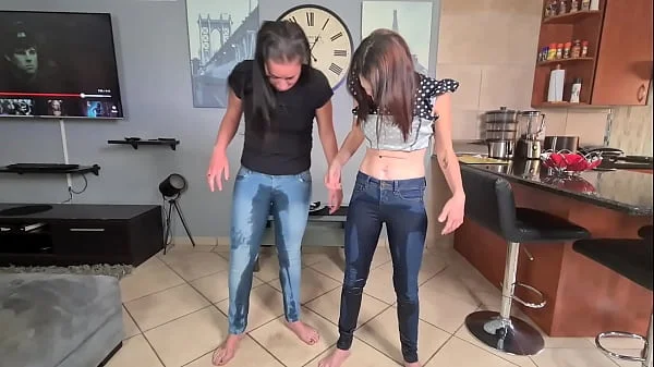 Two piss sluts soaking and wetting their jeans with pee and starts getting undressed afterwards