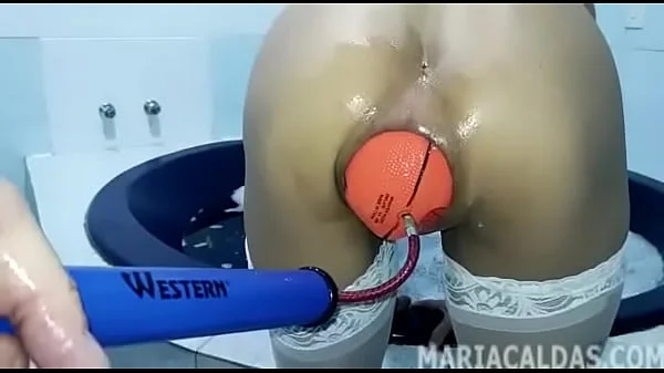 Maria Caldas inserting a giant inflatable basketball ball